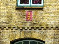 Posthorn und Monogramm des dänischen Königs Friedrich VI. (Am Mittelburgwall )